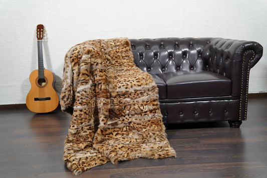 rabbit fur throw blanket leopard print — flowing rabbit fur pile, leopard print close-up detail — Greek craftsmanship, TatiFurs