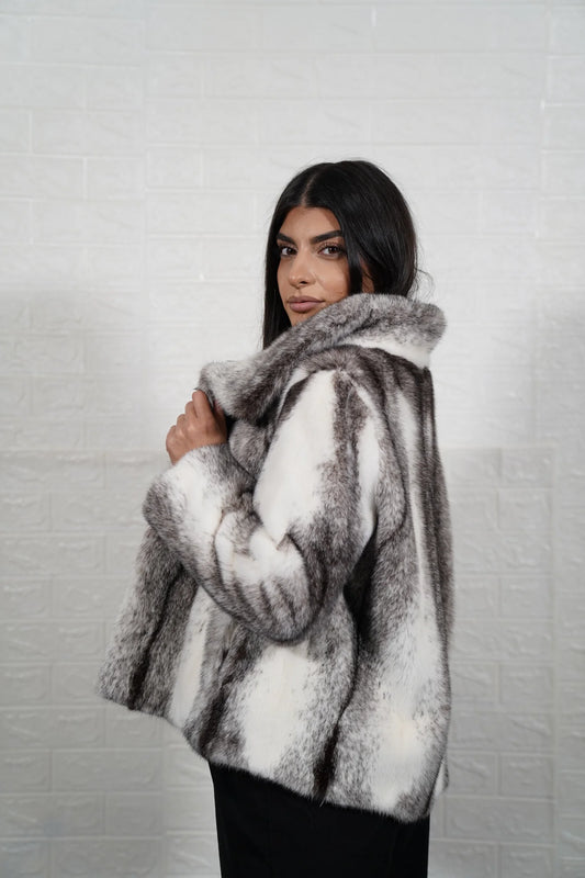 Mink fur jacket cross displaying dynamic black and white mixed pelt pattern and hip level silhouette with fur collar — Greek craftsmanship, TatiFurs