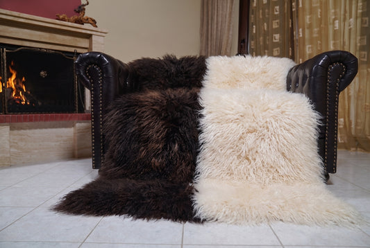 Mongolian Blanket Throw Dark Brown Cream Beige Two Tone spread across the leather sofa showing the whole espresso brown and cream beige Mongolian wool surface — Greek craftsmanship, TatiFurs