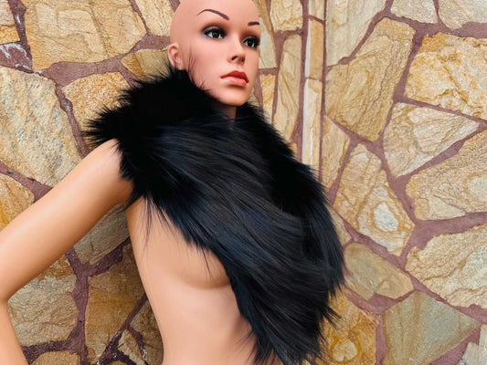 Woman wearing black fluffy full skin fox fur collar scarf styled as a collar