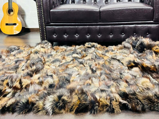 Fox Fur Blanket Throw Double Sided Mathilde - Tatifurs placed on a luxurious sofa, showcasing its rich, complex colors.