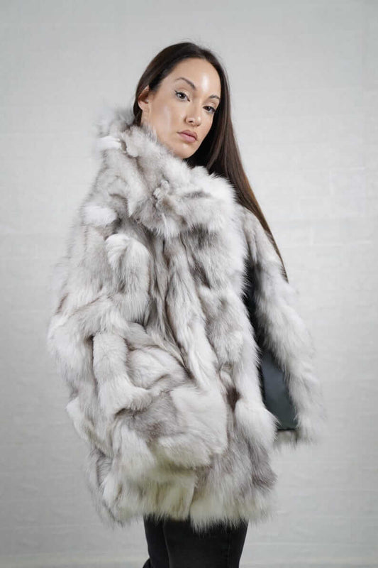 Model wearing natural blue fox fur coat jacket with collar, styled for winter