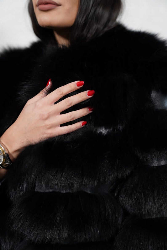 Close-up of leather lines between black fox fur panels