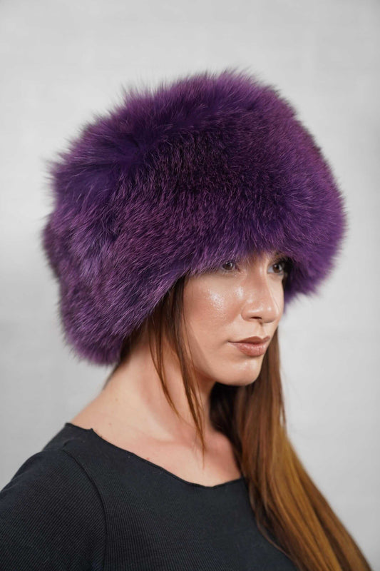 Fox Fur Hat Purple Full Skin - Tatifurs displayed on a model, showcasing luxurious purple fox fur in winter fashion.