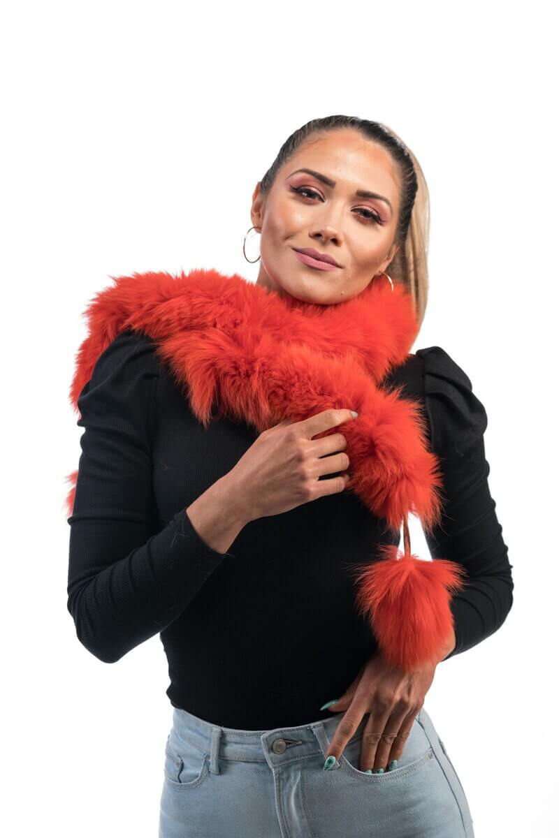 Orange Fox Fur Scarf with Pom Poms - Tatifurs worn by model, showcasing vibrant color and playful pom poms.