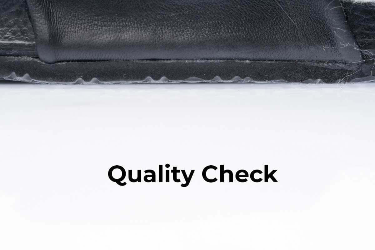 Quality Check for Fox Fur Slides Black - Tatifurs ensuring high standards.