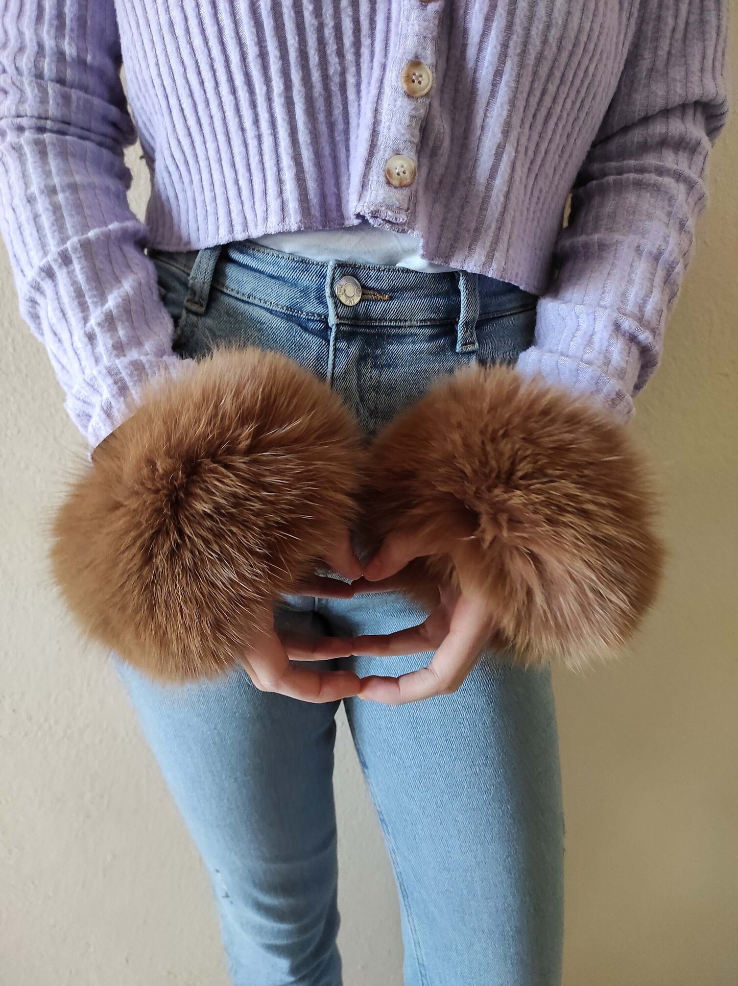Brown Fox Fur Cuffs – 100% Real Fur - Tatifurs being showcased on a model's wrists, highlighting their luxurious texture.