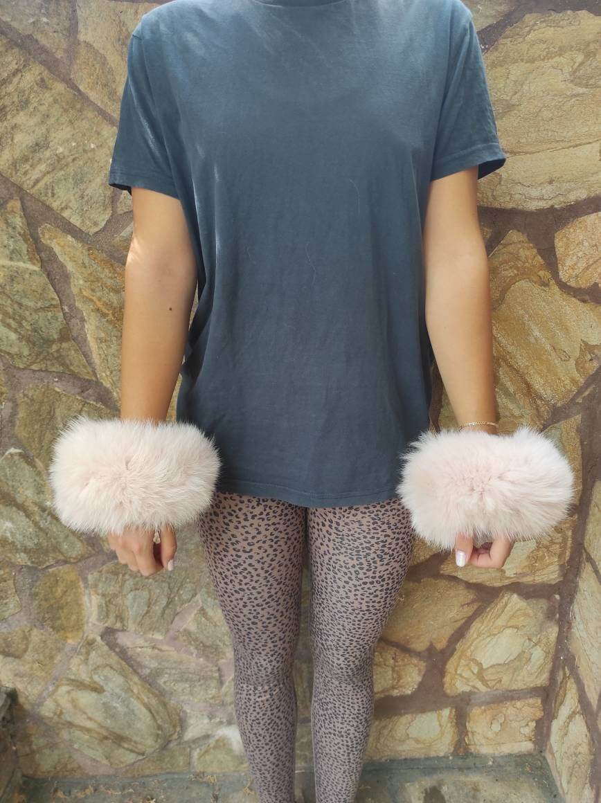 Baby Pink Fox Fur Cuffs - Tatifurs worn by model, showcasing their soft blush color and stylish design.