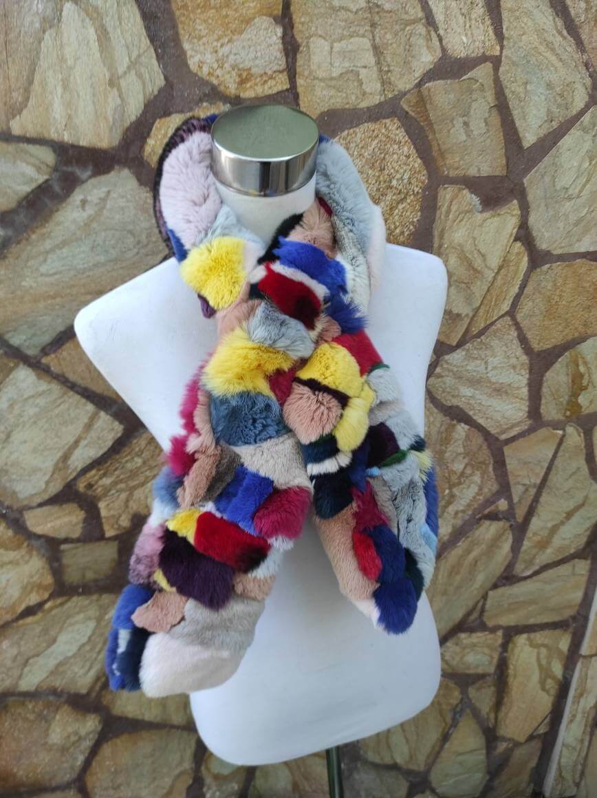 Rex Rabbit Fur Scarf Colorful - Tatifurs displayed on a mannequin showcasing its vibrant, bold colors and soft texture.