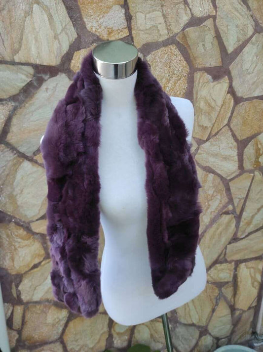 Rex Rabbit Fur Scarf Purple - Tatifurs displayed on a mannequin against a stone background, showcasing luxurious purple fur.