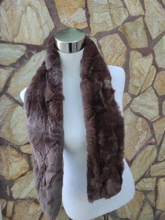 Rex Rabbit Fur Scarf Chocolate Brown - Tatifurs displayed on a mannequin against a textured stone background.