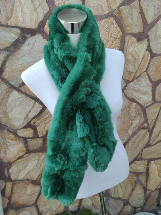 Rex Rabbit Fur Scarf Green - Tatifurs displayed on a mannequin against a stone background.