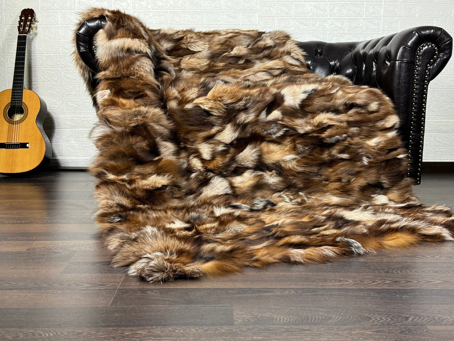 Handmade real fox fur throw blankets in multiple colors displayed on sofa