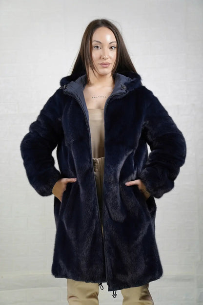 Mink fur coat reversible blue hood worn up showing mink lined hood framing face in deep luminous blue matched to coat body — Greek craftsmanship, TatiFurs
