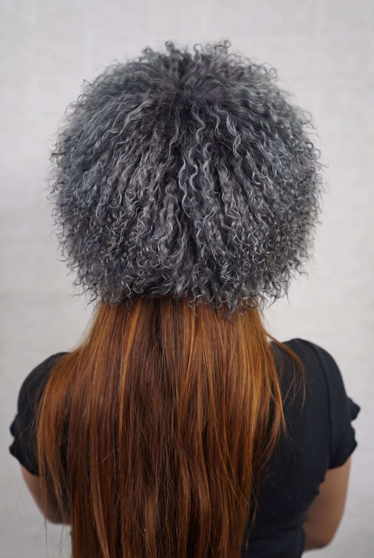 Mongolian Sheepskin Hat Grey — Curly Lamb Fur, One Size shown from the back, dense smoky charcoal grey Mongolian sheepskin pile from crown to nape — TatiFurs
