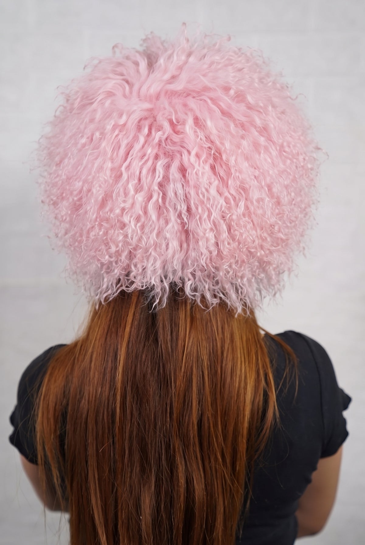 Mongolian Sheepskin Hat Pink — Curly Lamb Fur, One Size shown from the back, dense pale powder pink Mongolian sheepskin pile from crown to nape — TatiFurs