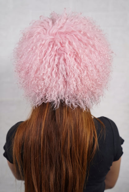 Mongolian Sheepskin Hat Pink — Curly Lamb Fur, One Size shown from the back, dense pale powder pink Mongolian sheepskin pile from crown to nape — TatiFurs