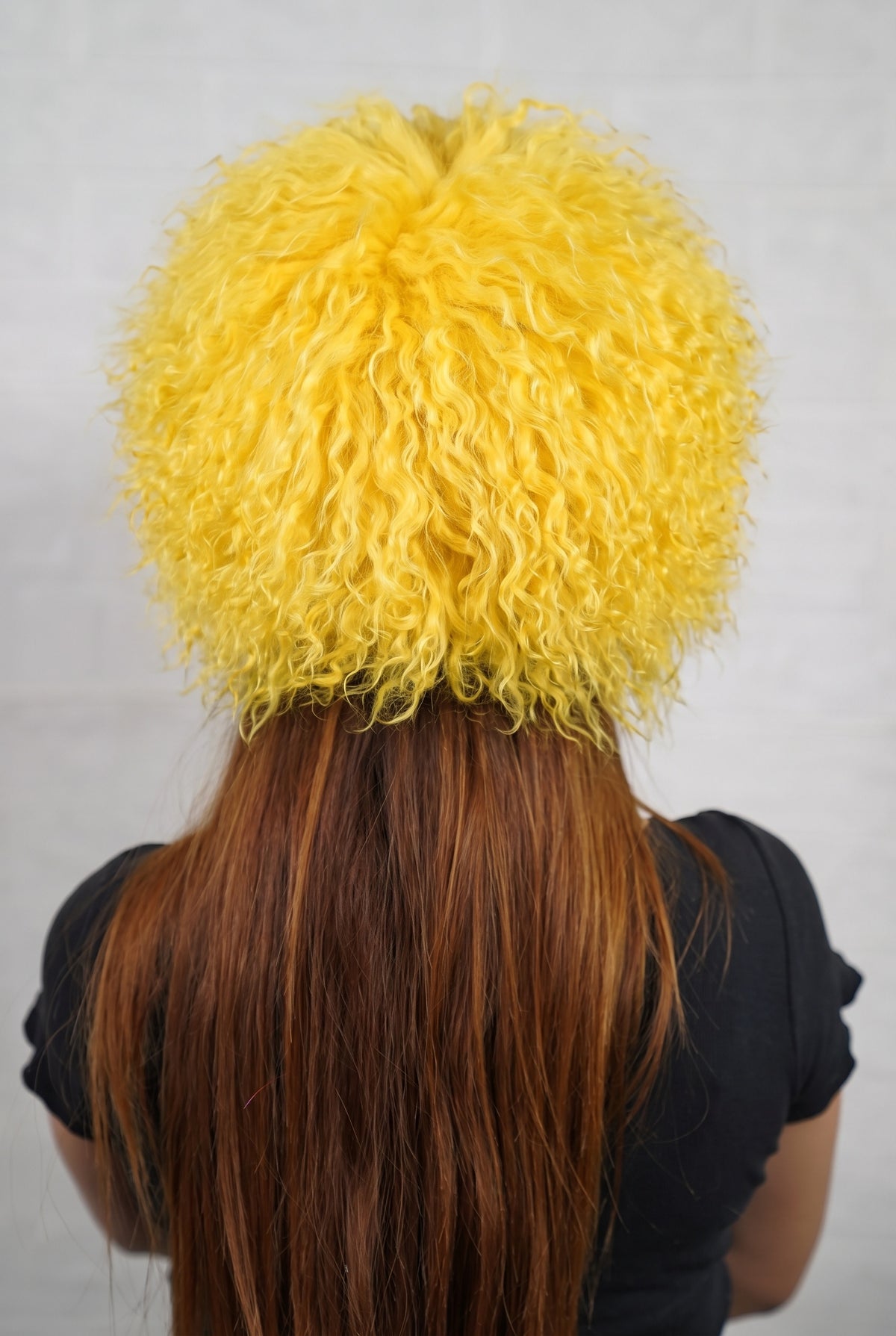 Mongolian Sheepskin Hat Yellow — Curly Lamb Fur, One Size shown from the back, dense warm sunflower yellow Mongolian sheepskin pile from crown to nape — TatiFurs