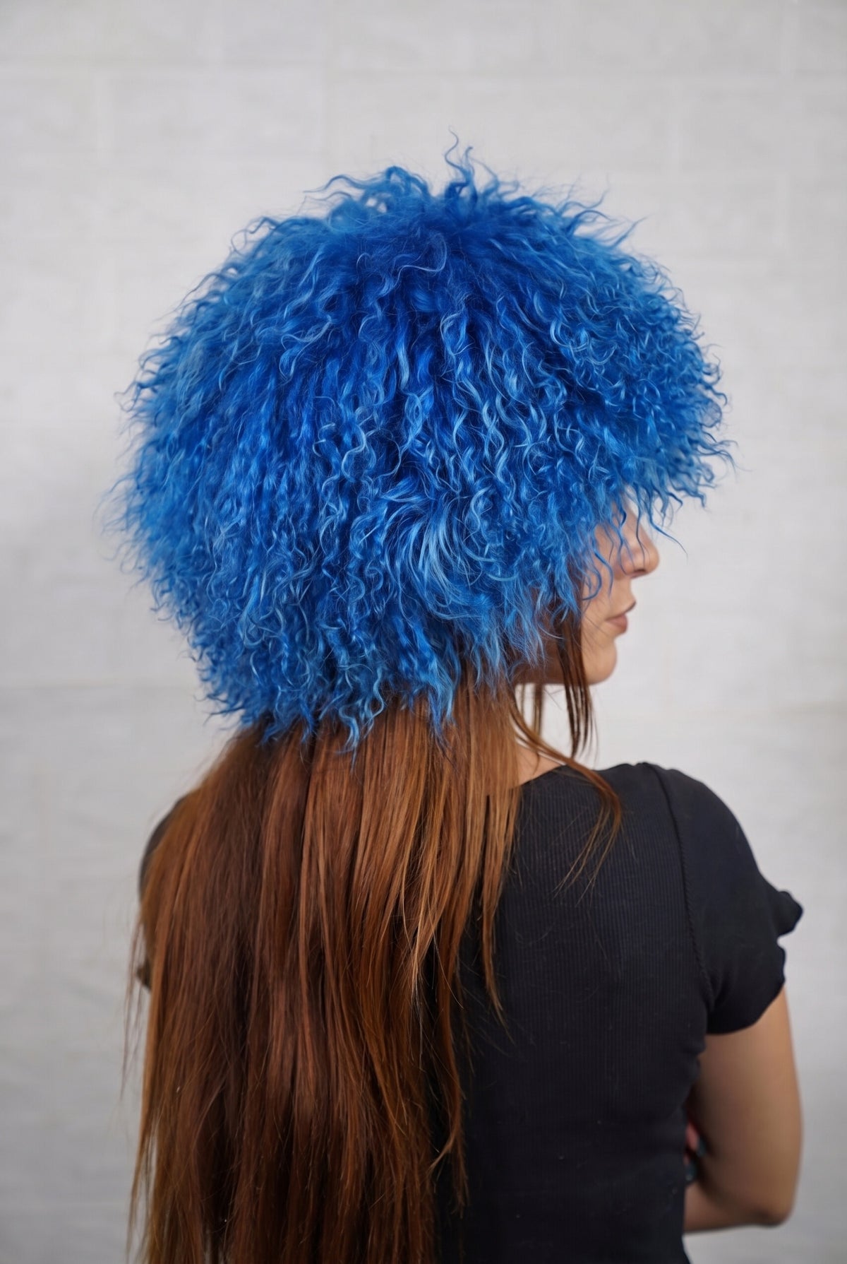 Mongolian Sheepskin Hat Blue — Curly Lamb Fur, One Size three-quarter back view showing the rich cobalt blue curls covering the crown and nape — Greek craftsmanship, TatiFurs
