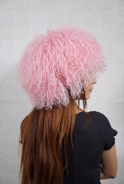 Mongolian Sheepskin Hat Pink — Curly Lamb Fur, One Size three-quarter back view showing the pale powder pink curls covering the crown and nape — Greek craftsmanship, TatiFurs