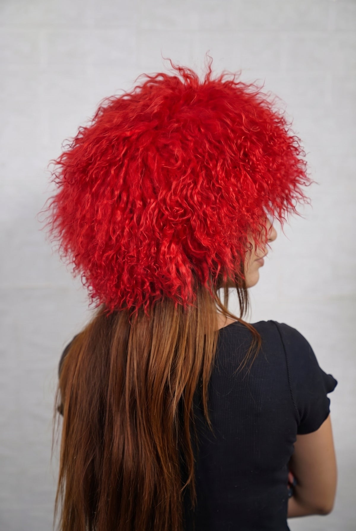 Mongolian Sheepskin Hat Red — Curly Lamb Fur, One Size three-quarter back view showing the vivid scarlet red curls covering the crown and nape — Greek craftsmanship, TatiFurs