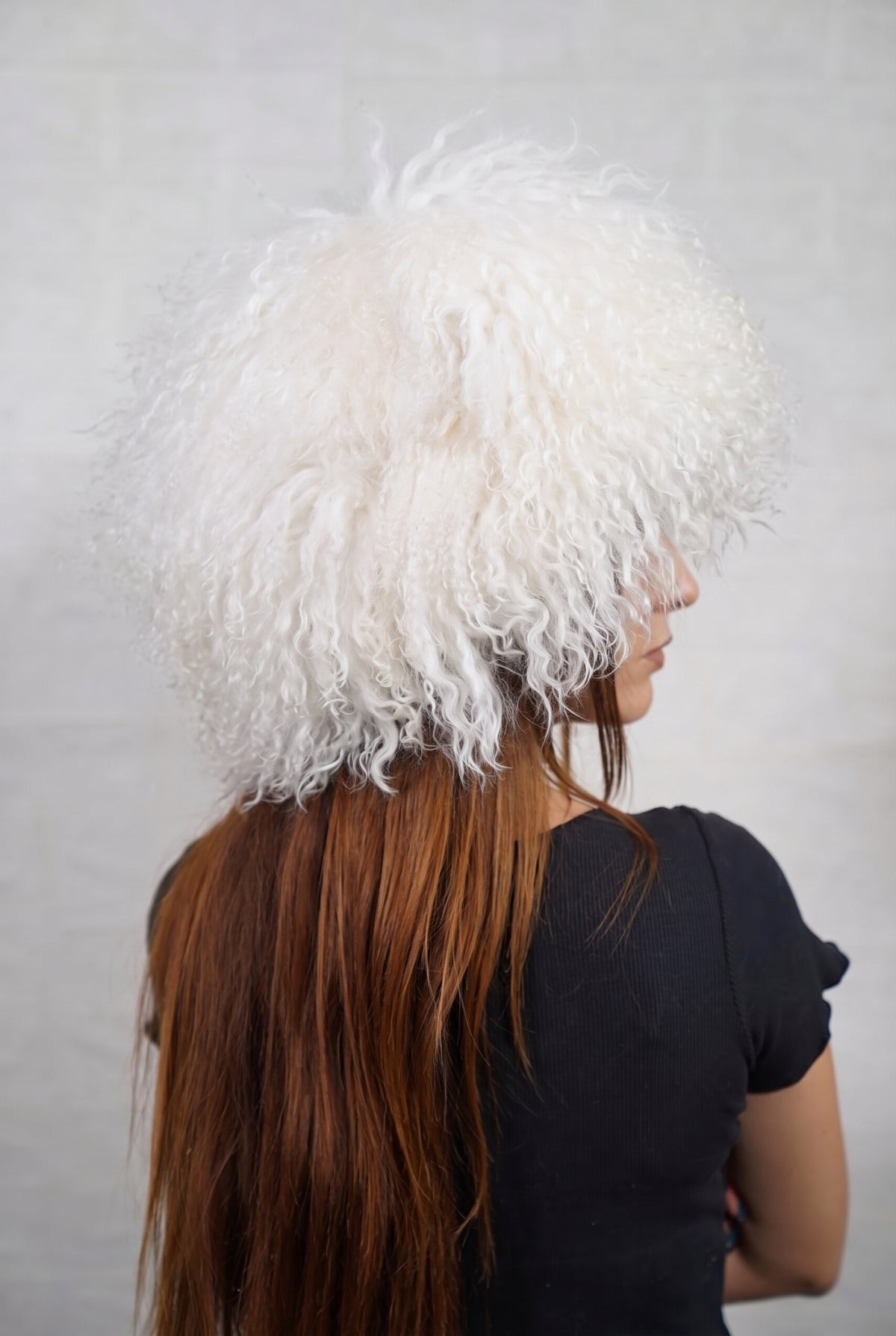 Mongolian Sheepskin Hat White — Curly Lamb Fur, One Size three-quarter back view showing the pure snow white curls covering the crown and nape — Greek craftsmanship, TatiFurs