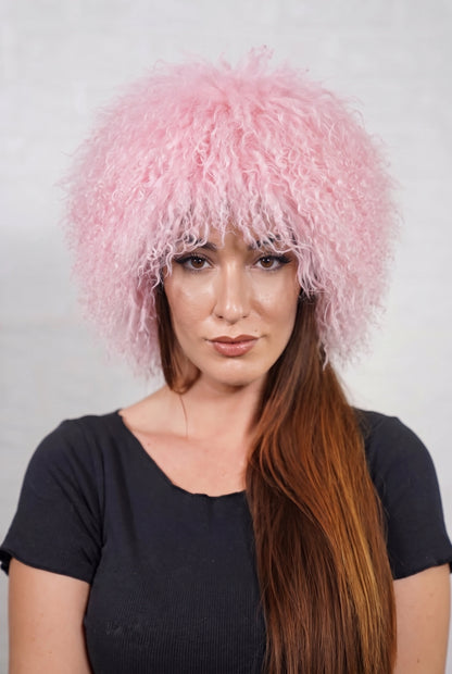 Mongolian Sheepskin Hat Pink — Curly Lamb Fur, One Size shown from the front, full round silhouette of pale powder pink Mongolian lamb curls over the forehead — handmade in Greece, TatiFurs