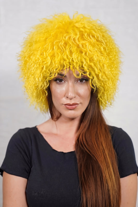 Mongolian Sheepskin Hat Yellow — Curly Lamb Fur, One Size shown from the front, full round silhouette of warm sunflower yellow Mongolian lamb curls over the forehead — handmade in Greece, TatiFurs
