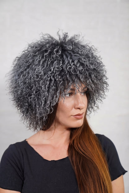 Mongolian Sheepskin Hat Grey — Curly Lamb Fur, One Size in profile displaying the volume and length of the smoky charcoal grey curly sheepskin pile over the ear — TatiFurs