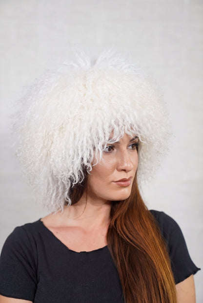 Mongolian Sheepskin Hat White — Curly Lamb Fur, One Size in profile displaying the volume and length of the pure snow white curly sheepskin pile over the ear — TatiFurs