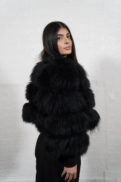 Alpaca fur jacket black women shown full length from front displaying bomber neckline and button closure in horizontal leather framed black alpaca rows — Greek craftsmanship, TatiFurs
