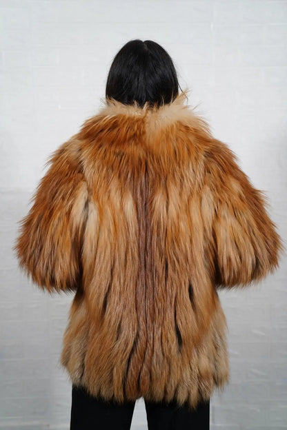 Fox fur jacket gold shown from the side displaying hip level silhouette and warm radiant gold fox full skin natural drape — Greek craftsmanship, TatiFurs
