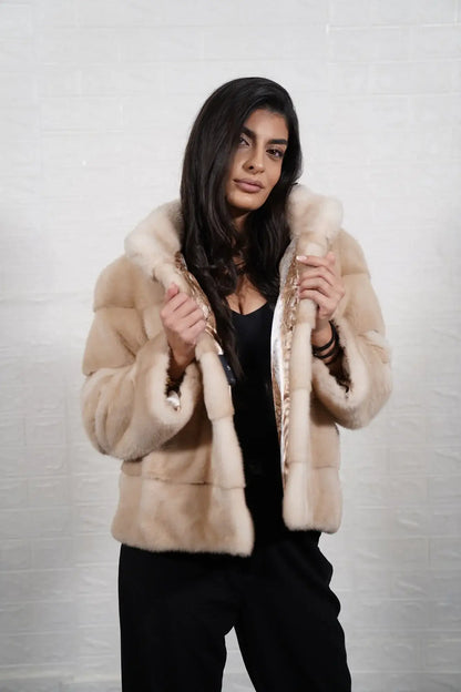 Mink fur jacket pastel beige shown from the back displaying full hip level silhouette and soft consistent pastel beige skin on skin mink flow — Greek craftsmanship, TatiFurs
