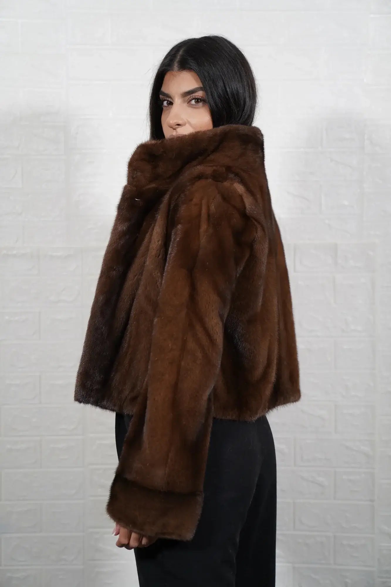 Mink fur jacket brown shown from the side displaying hip level silhouette and uniform flat brown solid pattern mink surface — Greek craftsmanship, TatiFurs
