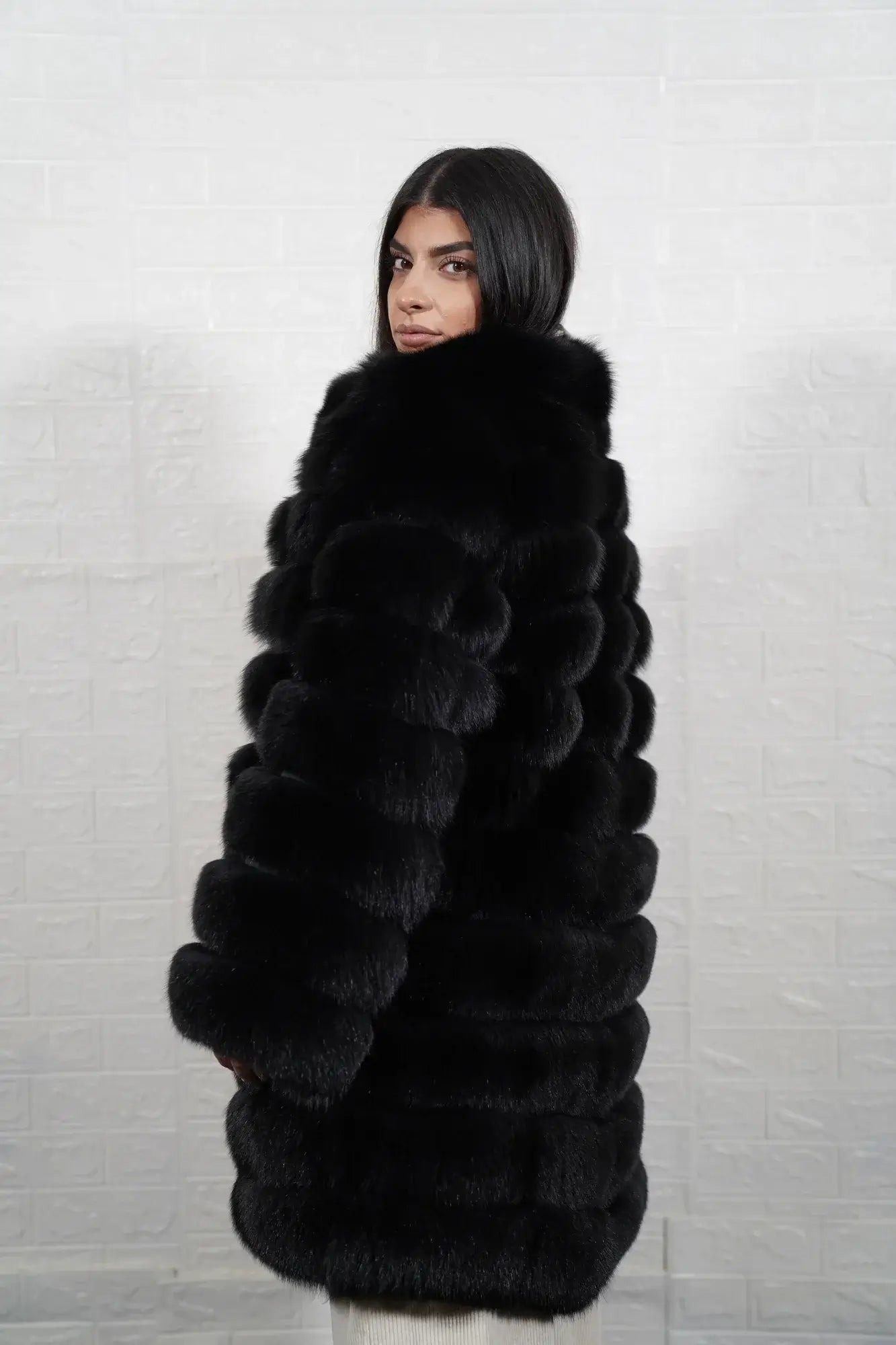 Fox fur coat black women shown full length from front displaying collarless neckline and button closure in horizontal leather framed black fox rows — Greek craftsmanship, TatiFurs
