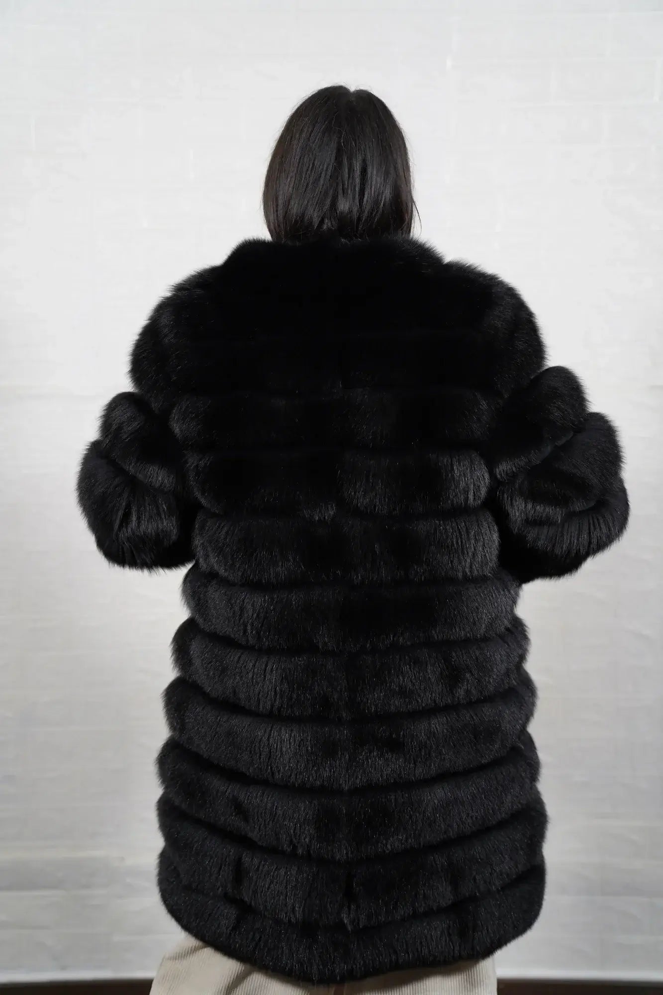 Fox fur coat black button closure detail showing clean commanding front line on horizontal leather trim black fox knee length coat — Greek craftsmanship, TatiFurs
