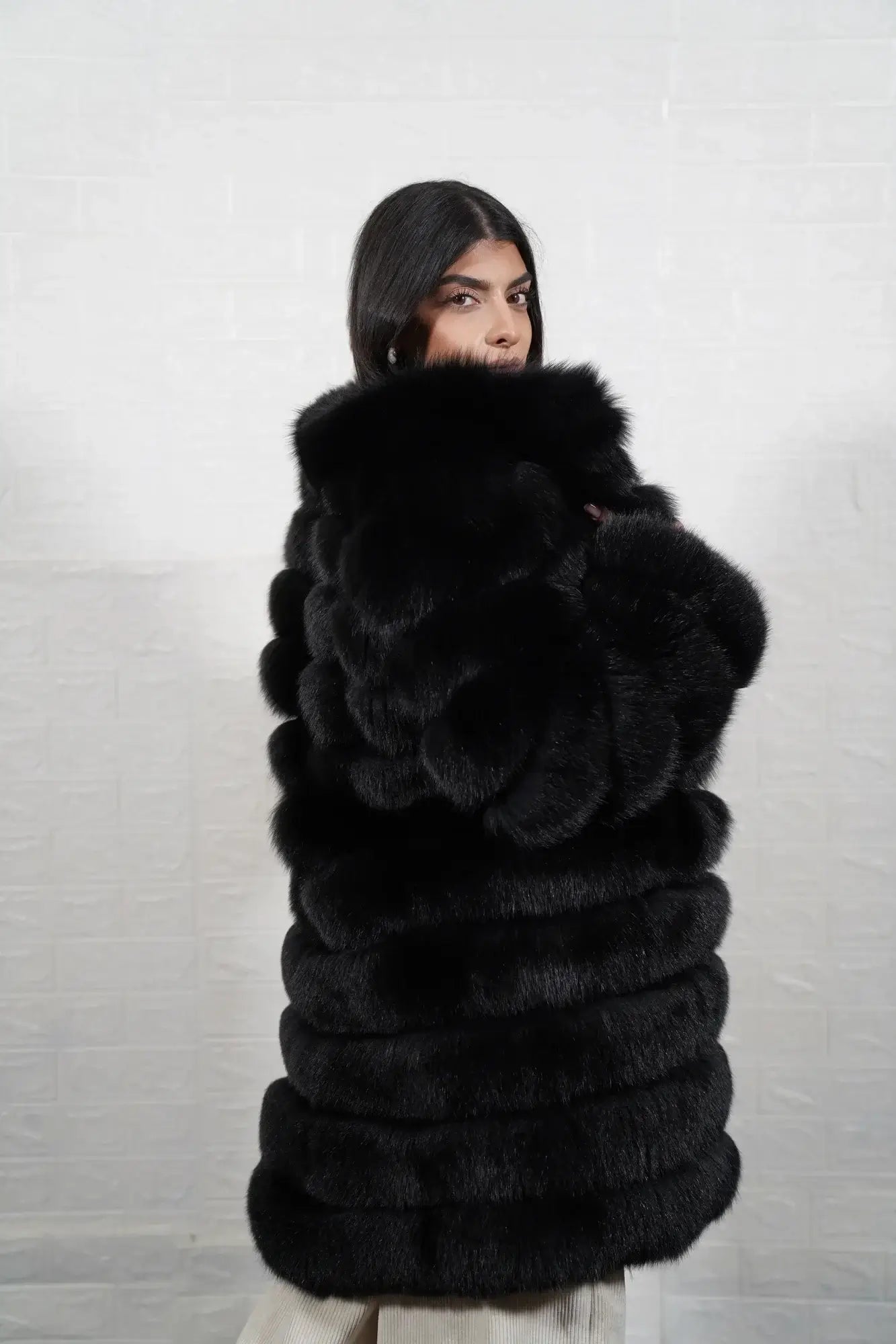 Fox fur coat black leather strip close-up showing clean horizontal leather lines separating full skin black fox fur rows — Greek craftsmanship, TatiFurs
