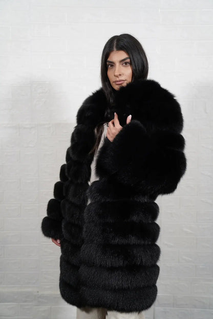 Fox fur coat black shown from the back displaying full knee length silhouette and horizontal leather strip construction across black fox rows — Greek craftsmanship, TatiFurs
