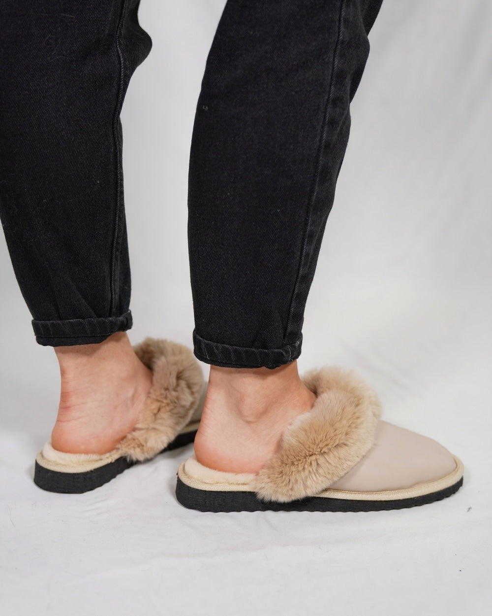 Sheepskin Wool Leather Slippers Beige - Tatifurs worn by a model, showcasing their luxurious design and comfort.
