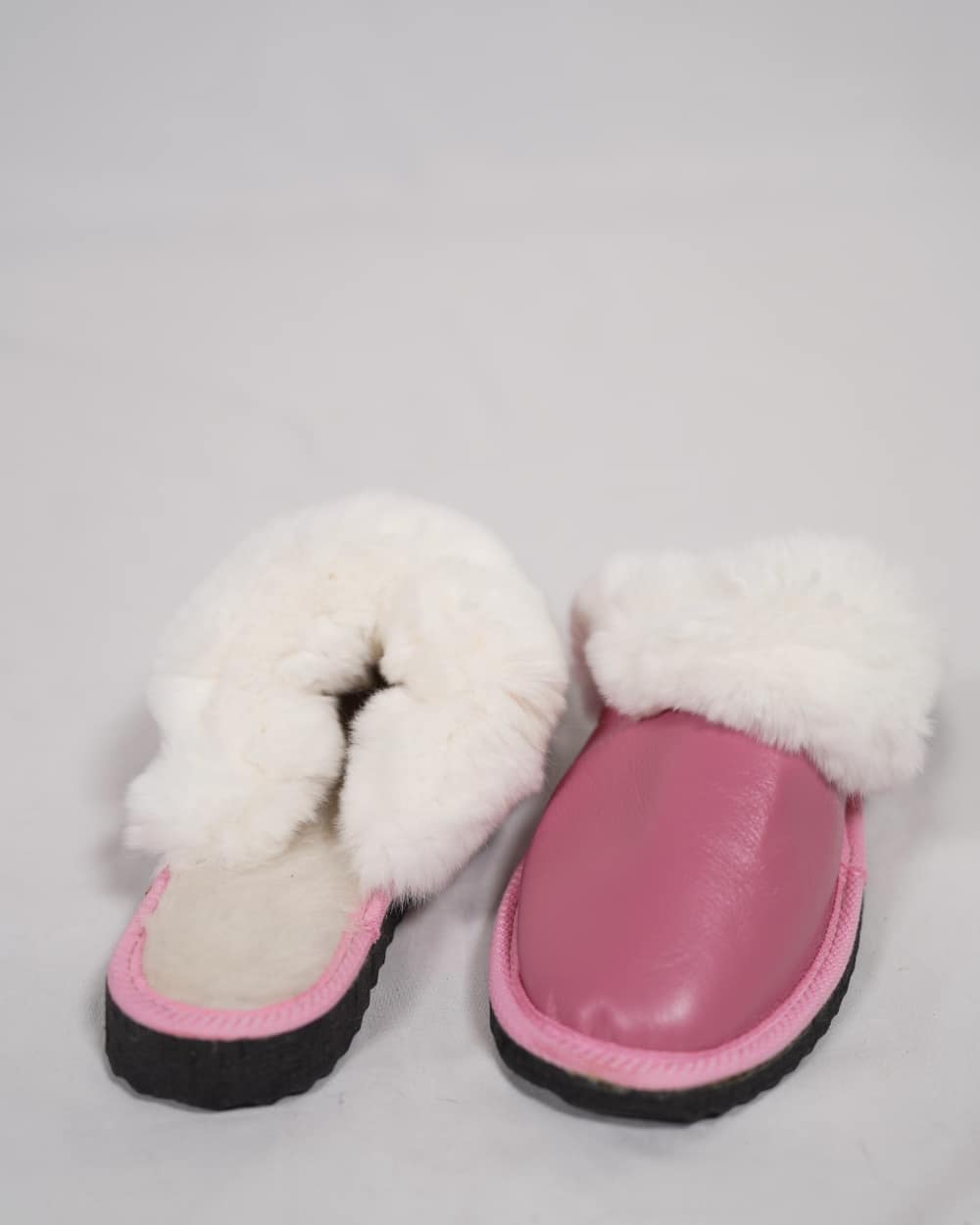 Sheepskin Wool Leather Fur Slippers Pink for Women with soft white fur lining and genuine pink leather exterior.