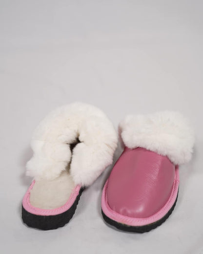 Sheepskin Wool Leather Fur Slippers Pink for Women with soft white fur lining and genuine pink leather exterior.