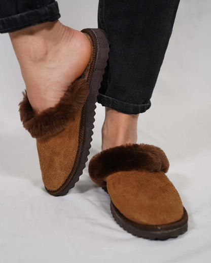 Sheepskin Wool Leather Fur Slippers Brown - Tatifurs worn on feet, showcasing luxurious comfort and style.