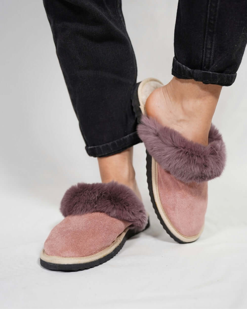 Sheepskin Wool Slippers Baby Pink for Women - Tatifurs worn by a model, showcasing comfort and style.