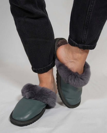 Sheepskin Wool Leather Fur Slippers Gray - Tatifurs worn by a model with gray fur lining and leather exterior.