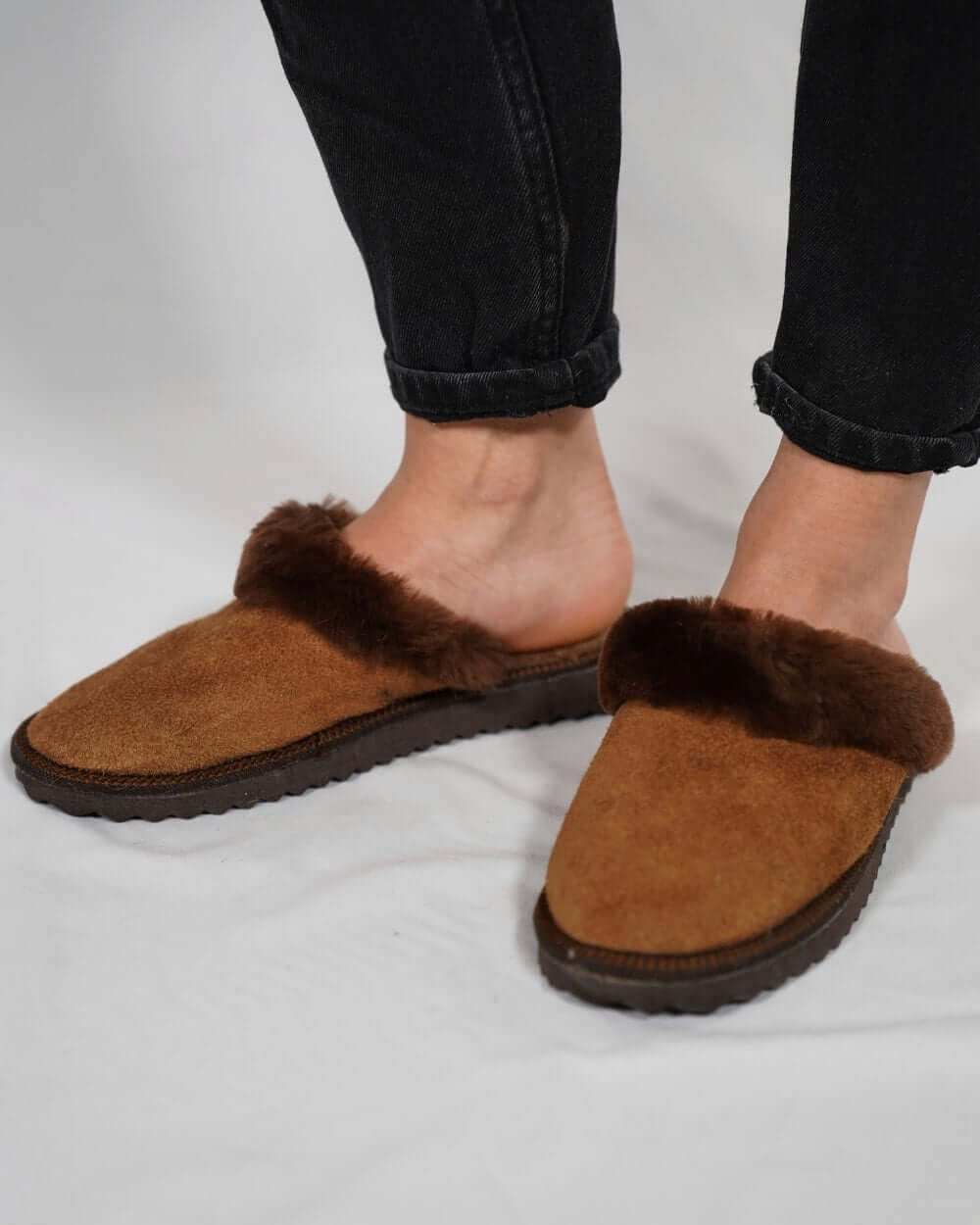 Sheepskin Wool Leather Fur Slippers Brown - Tatifurs on feet, showcasing luxurious comfort and warmth.