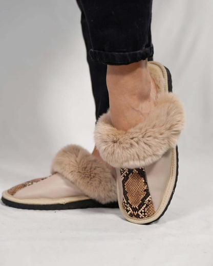 Sheepskin Wool Leather Fur Slippers Beige Leopard on a foot, showcasing luxurious design and comfort.