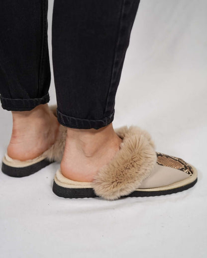 Sheepskin Wool Leather Fur Slippers Beige Leopard worn casually on a woman's feet, showcasing comfort and style.