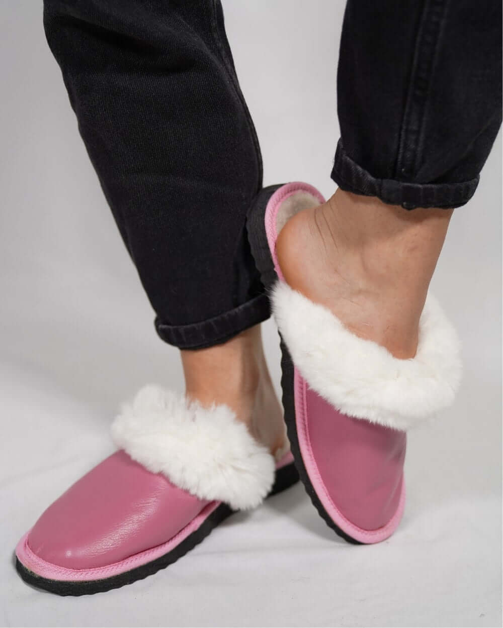 Sheepskin Wool Leather Fur Slippers Pink for Women worn by a model showing comfort and style.