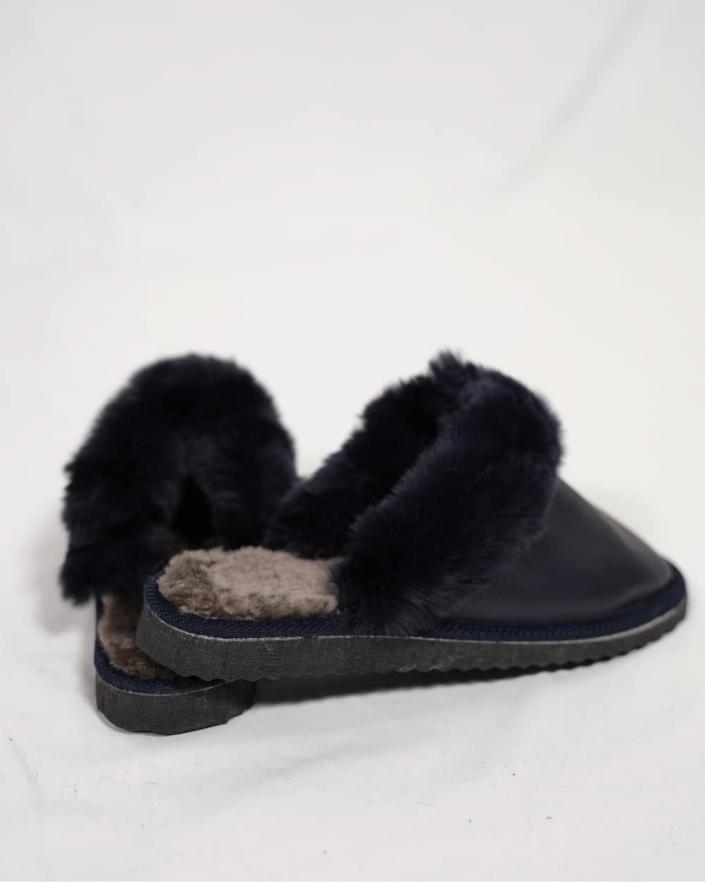 Sheepskin Wool Leather Fur Slippers Blue for Women side view showcasing soft fur lining.