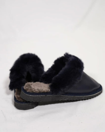 Sheepskin Wool Leather Fur Slippers Blue for Women side view showcasing soft fur lining.